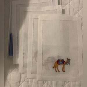 Set of four linen cocktail napkins with a camel